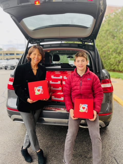 Connor Wright with his nana distribute Connor Kindness Project care packages