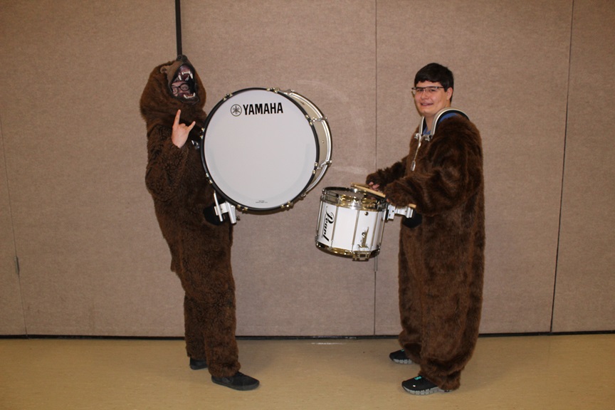 Gardiner students play drums in animal costumes