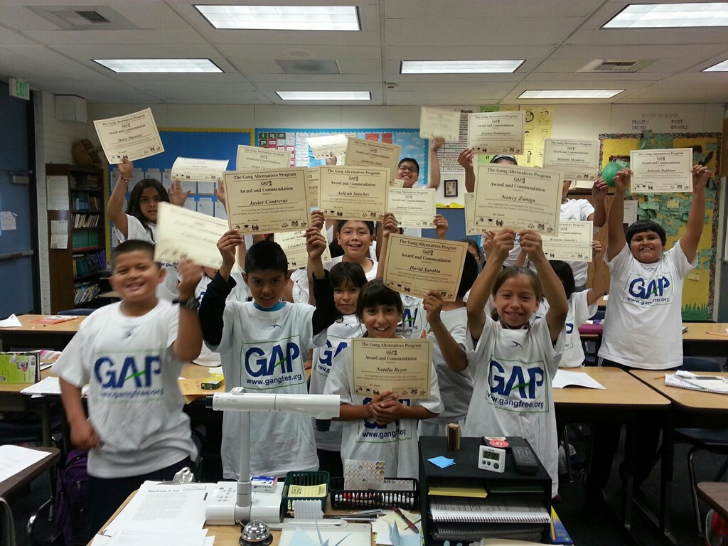 GAP gangfree.org participants hold up their diplomas