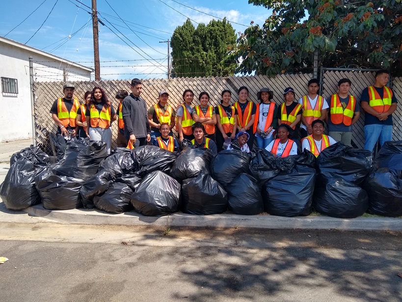 SYEP teens group photo with full garbage bags