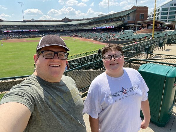 Big Brothers Big Sisters of Kentuckiana big brothers at a stadium to attend a sporting event