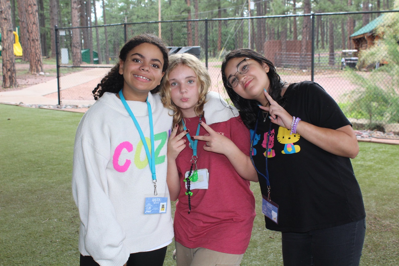 Arizona Camp Sunrise and Sidekicks Southwest Kids Cancer Foundation group photo, three smiling girls